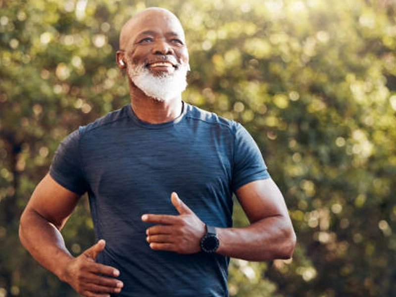 A man in his sixties running outdoors on a bright morning, from the vendor's lifestyle artwork